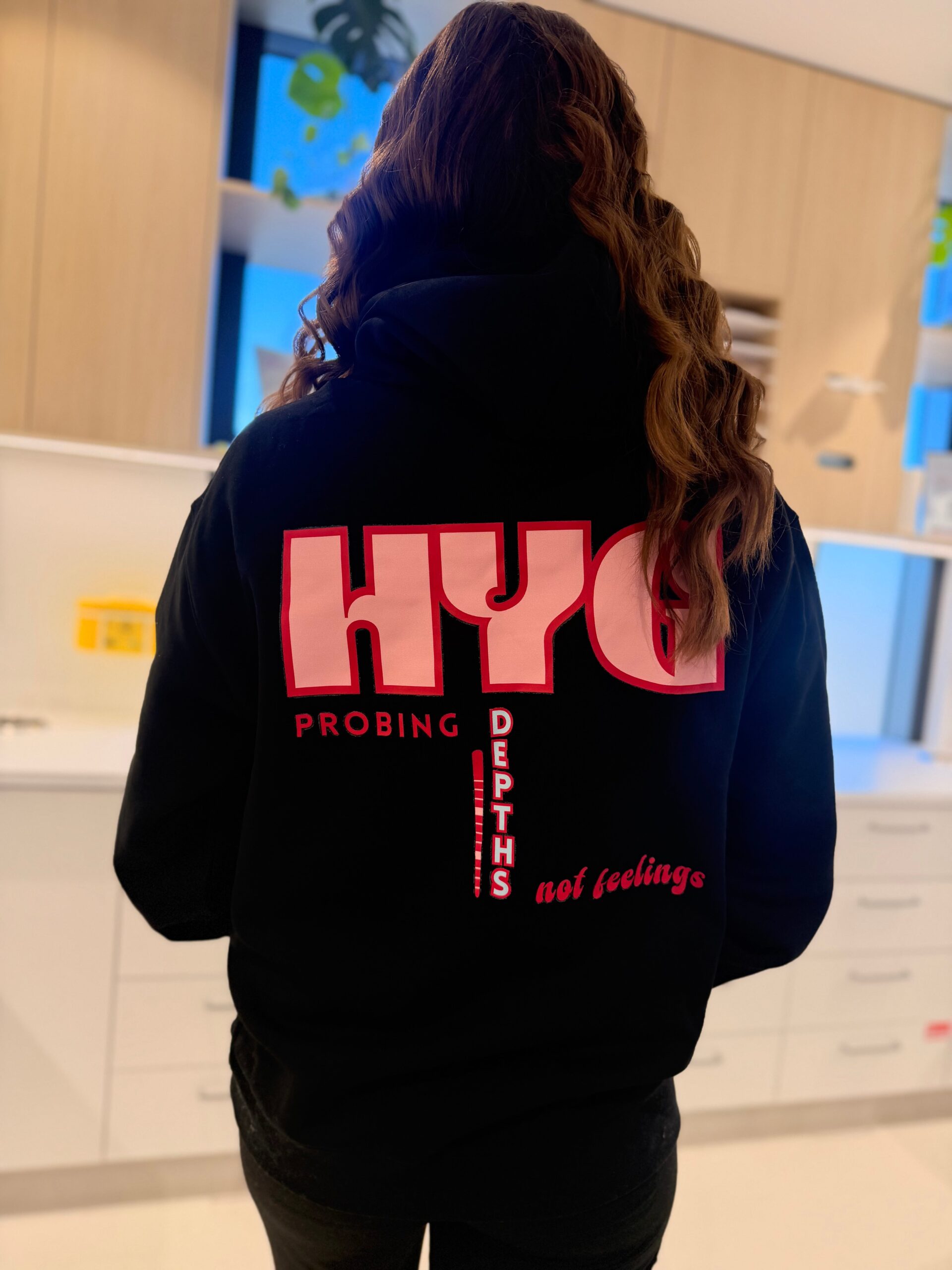 Hygienist hoodie in black, back print reading Probing Depths Not Feelings